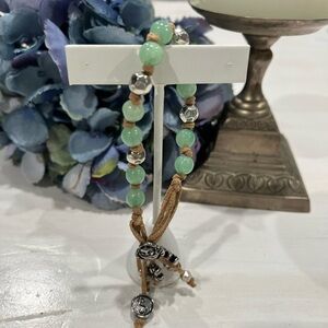 Charm Bracelet leather with metals, glass green beads,‎ yin & yang, buddah